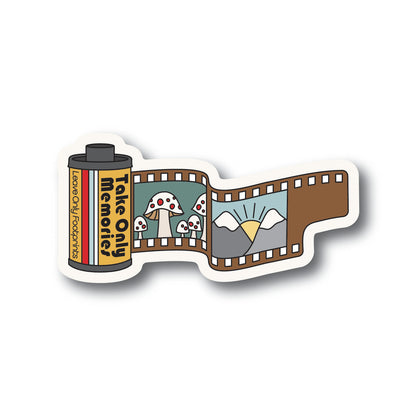 A sticker with a roll of film that says Take Only Memories, Leave Only Footprints with images of mushrooms and mountains on the film