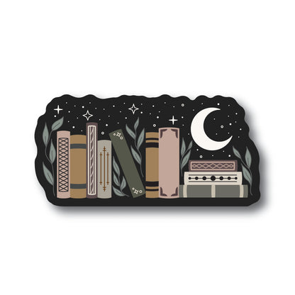 Black sticker with leaves, stars and a crescent moon surround a row of books